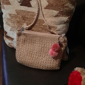 The Sak Tan Woven Crossbody Bag with Pink Pom-Pom